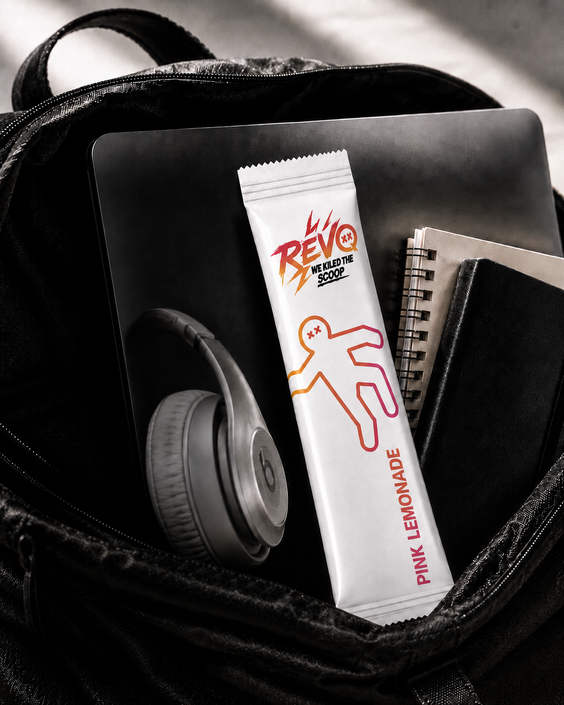 Revo creatine and electrolyte stick pack next to a glass of water